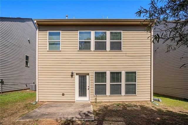 back of property featuring a patio and central air condition unit