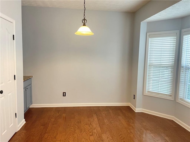 795 Abbotts Mill Ct Unit 73, Johns Creek, GA 30097 - unfurnished dining area featuring dark wood-style flooring and baseboards