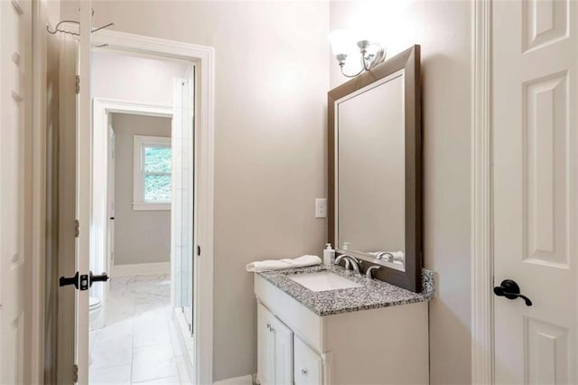 bathroom with tile patterned flooring and vanity