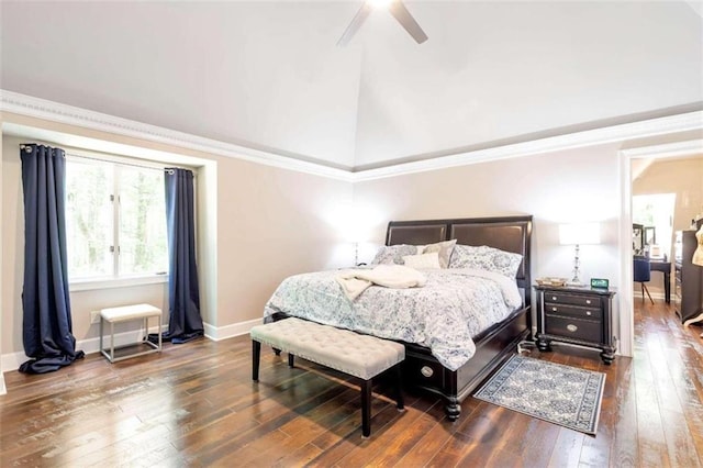 bedroom featuring dark hardwood / wood-style floors, vaulted ceiling, crown molding, and ceiling fan