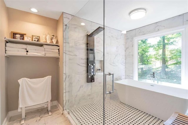 bathroom featuring shower with separate bathtub and tile patterned floors