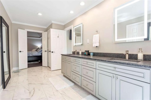 bathroom with tile patterned floors, crown molding, and dual bowl vanity