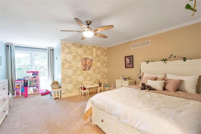 bedroom featuring crown molding, light colored carpet, and ceiling fan