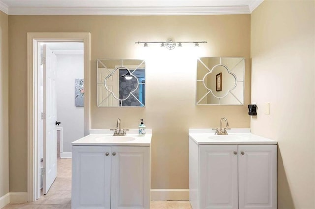 bathroom featuring tile patterned flooring, crown molding, and dual bowl vanity