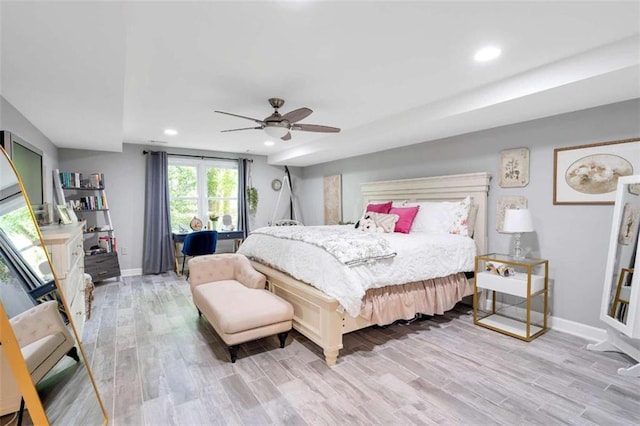 bedroom featuring ceiling fan and light hardwood / wood-style floors