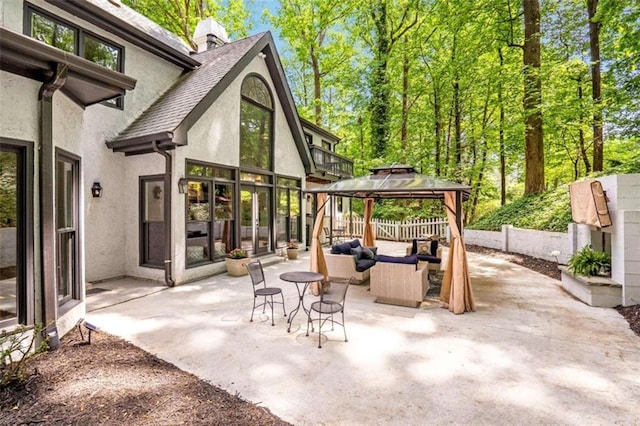 view of patio featuring a gazebo and an outdoor hangout area