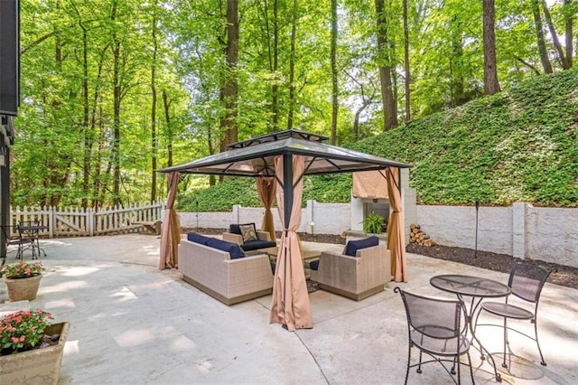 view of patio / terrace with an outdoor living space and a gazebo