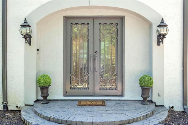 property entrance featuring french doors