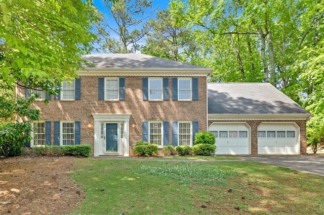 4181 Singing Post Ln NE, Roswell, GA 30075 - view of front of property featuring a garage, asphalt driveway, brick siding, and a front lawn