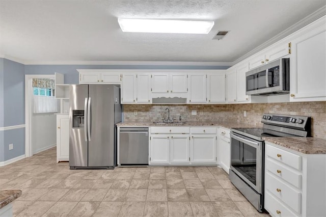 4181 Singing Post Ln NE, Roswell, GA 30075 - kitchen featuring appliances with stainless steel finishes, a sink, white cabinets, backsplash, and ornamental molding