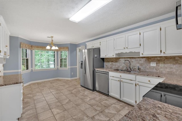 4181 Singing Post Ln NE, Roswell, GA 30075 - kitchen with a sink, appliances with stainless steel finishes, light stone countertops, a chandelier, and decorative backsplash