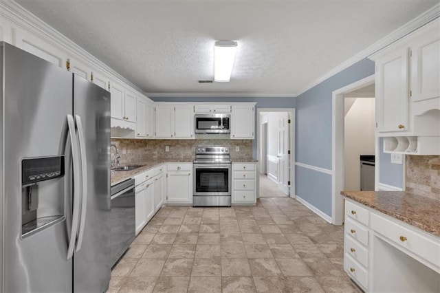 4181 Singing Post Ln NE, Roswell, GA 30075 - kitchen featuring appliances with stainless steel finishes, a sink, tasteful backsplash, white cabinetry, and a textured ceiling