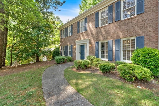 4181 Singing Post Ln NE, Roswell, GA 30075 - colonial home featuring brick siding and a front lawn
