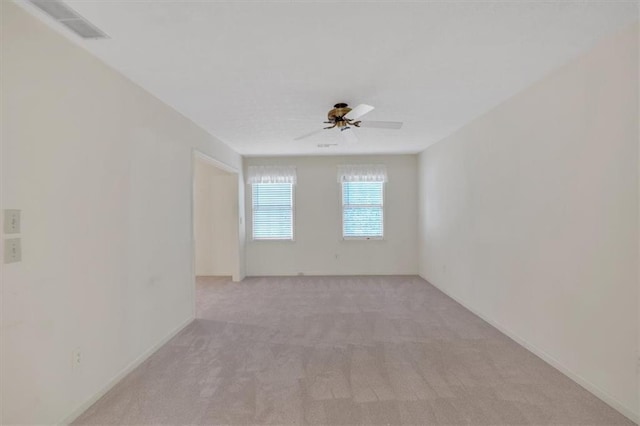 4181 Singing Post Ln NE, Roswell, GA 30075 - spare room featuring ceiling fan, light carpet, and baseboards