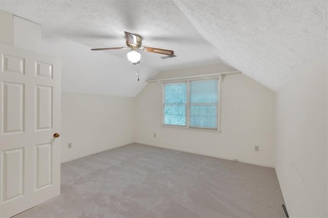 4181 Singing Post Ln NE, Roswell, GA 30075 - additional living space with light colored carpet, lofted ceiling, a textured ceiling, ceiling fan, and baseboards
