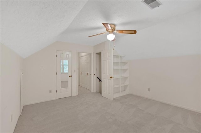 4181 Singing Post Ln NE, Roswell, GA 30075 - additional living space with vaulted ceiling, light colored carpet, a ceiling fan, a textured ceiling, and baseboards