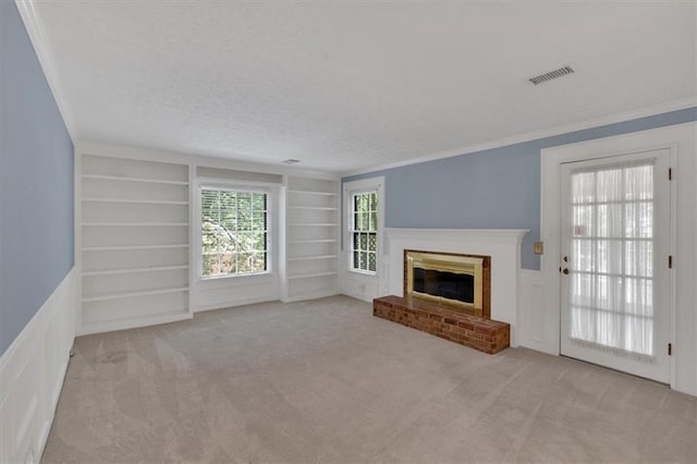 4181 Singing Post Ln NE, Roswell, GA 30075 - unfurnished living room featuring built in features, a brick fireplace, carpet, a textured ceiling, and crown molding