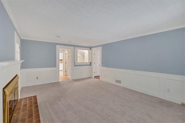 4181 Singing Post Ln NE, Roswell, GA 30075 - unfurnished living room with a decorative wall, ornamental molding, wainscoting, carpet floors, and a fireplace with flush hearth