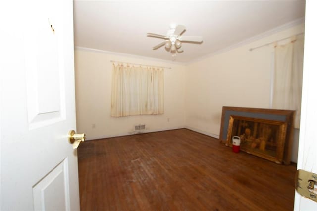 1398 Christmas Ln NE, Atlanta, GA 30329 - empty room featuring ceiling fan, wood finished floors, and ornamental molding