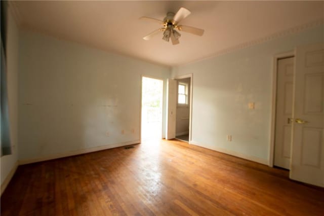 1398 Christmas Ln NE, Atlanta, GA 30329 - empty room featuring a ceiling fan, wood finished floors, baseboards, and ornamental molding