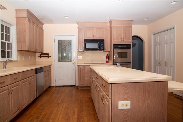 1398 Christmas Ln NE, Atlanta, GA 30329 - kitchen featuring appliances with stainless steel finishes, a sink, dark wood-style floors, light countertops, and recessed lighting