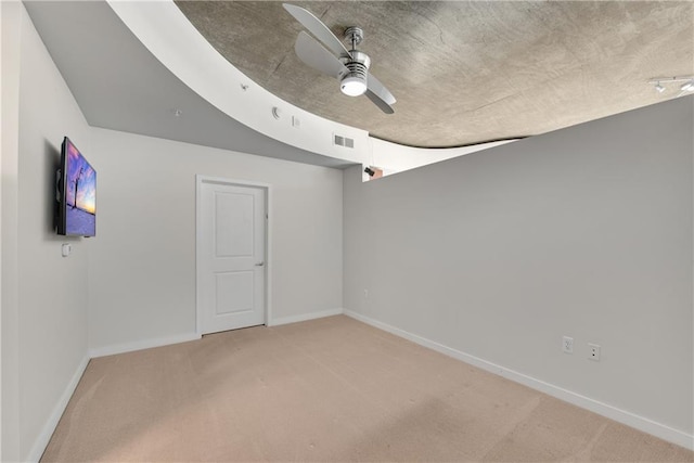 unfurnished room with carpet floors and ceiling fan