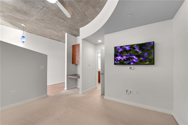 unfurnished living room with light colored carpet