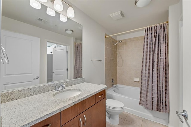 full bathroom with vanity, shower / bath combination with curtain, tile patterned floors, and toilet