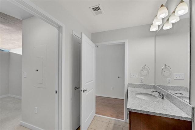 bathroom with tile patterned floors and vanity