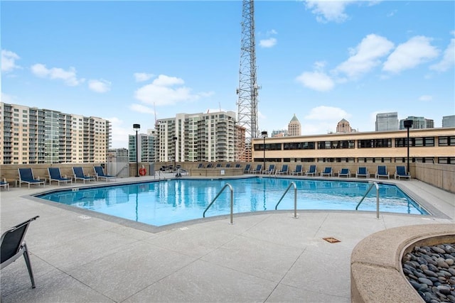 view of swimming pool with a patio