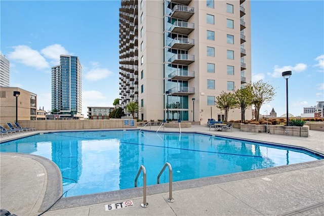 view of pool featuring a patio