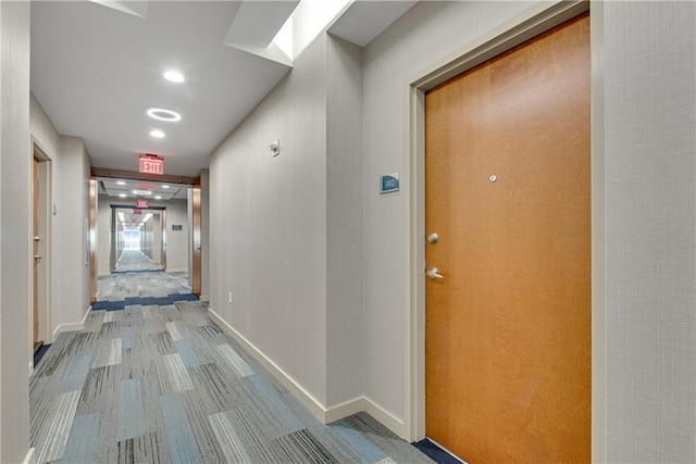 corridor featuring carpet flooring