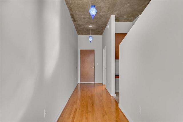 hall with wood-type flooring