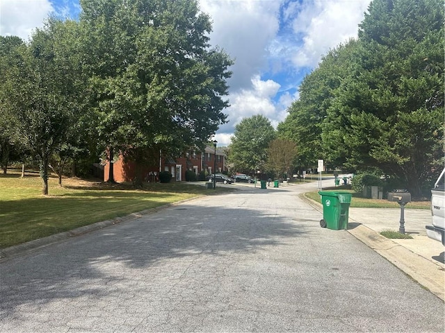 view of street featuring curbs