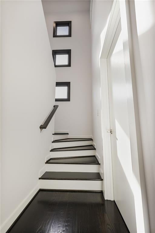 stairway with wood finished floors