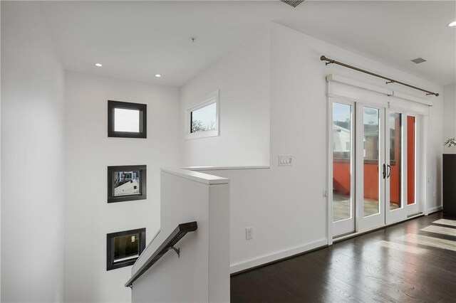 walk in closet with dark hardwood / wood-style flooring