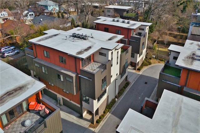 birds eye view of property with a residential view