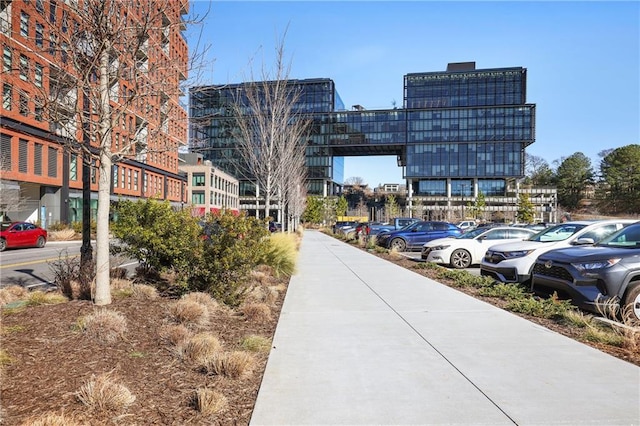 view of property's community featuring uncovered parking