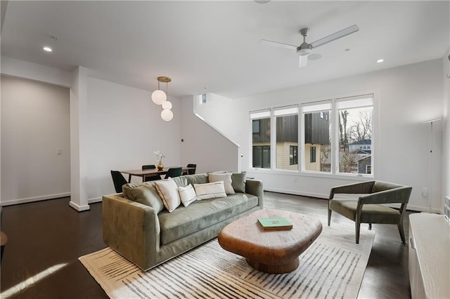 living room with recessed lighting, wood finished floors, visible vents, and baseboards