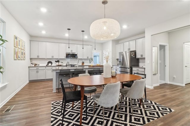 dining room featuring light hardwood / wood-style flooring