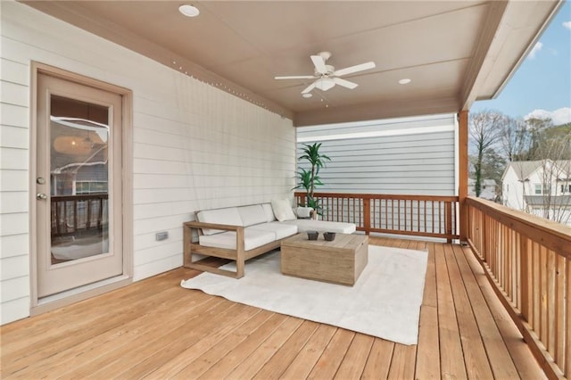 wooden terrace featuring ceiling fan and outdoor lounge area