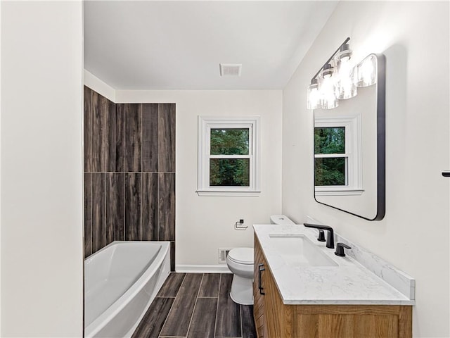 466 Thackery Pl SW, Atlanta, GA 30311 - bathroom with vanity, toilet, wood finished floors, baseboards, and bathtub / shower combination