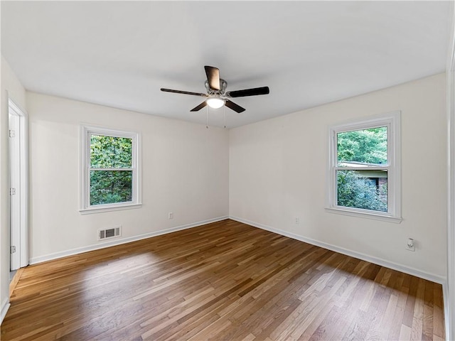 466 Thackery Pl SW, Atlanta, GA 30311 - unfurnished room featuring healthy amount of natural light, wood finished floors, baseboards, and a ceiling fan