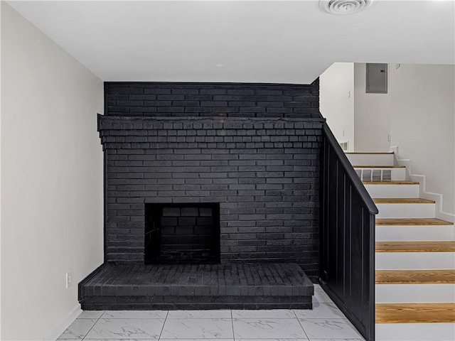 466 Thackery Pl SW, Atlanta, GA 30311 - stairway with marble look tile flooring, a brick fireplace, and baseboards