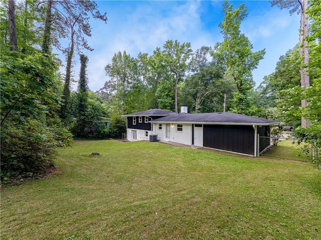 466 Thackery Pl SW, Atlanta, GA 30311 - rear view of house with a chimney and central air condition unit