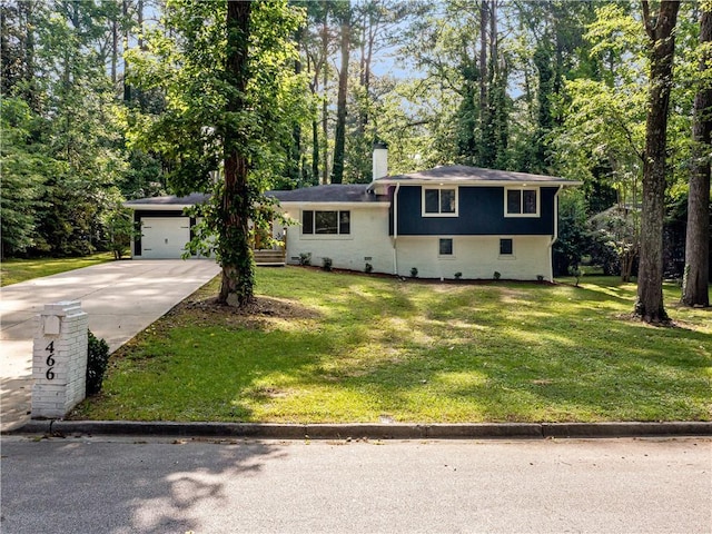 466 Thackery Pl SW, Atlanta, GA 30311 - tri-level home with concrete driveway, a front lawn, a chimney, and a garage