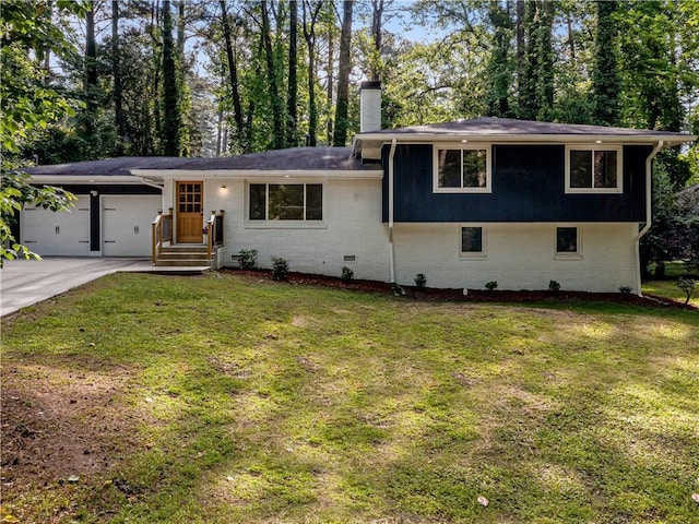 466 Thackery Pl SW, Atlanta, GA 30311 - tri-level home with a chimney, a front lawn, an attached garage, and concrete driveway