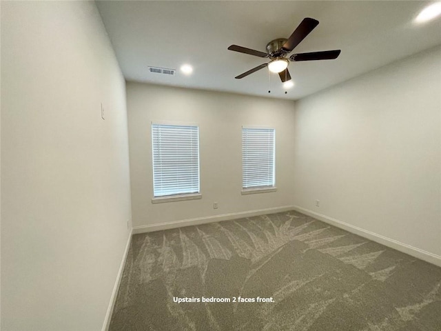 carpeted empty room with ceiling fan