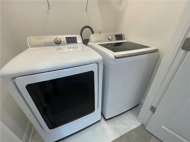 washroom with separate washer and dryer