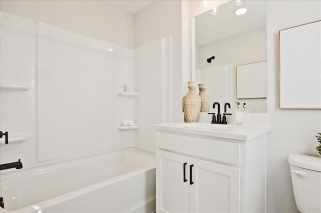 full bathroom with vanity, toilet, and  shower combination